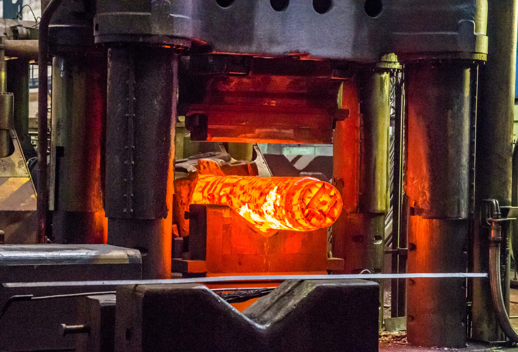 Red-hot Inconel billet forged under heavy hydraulic press