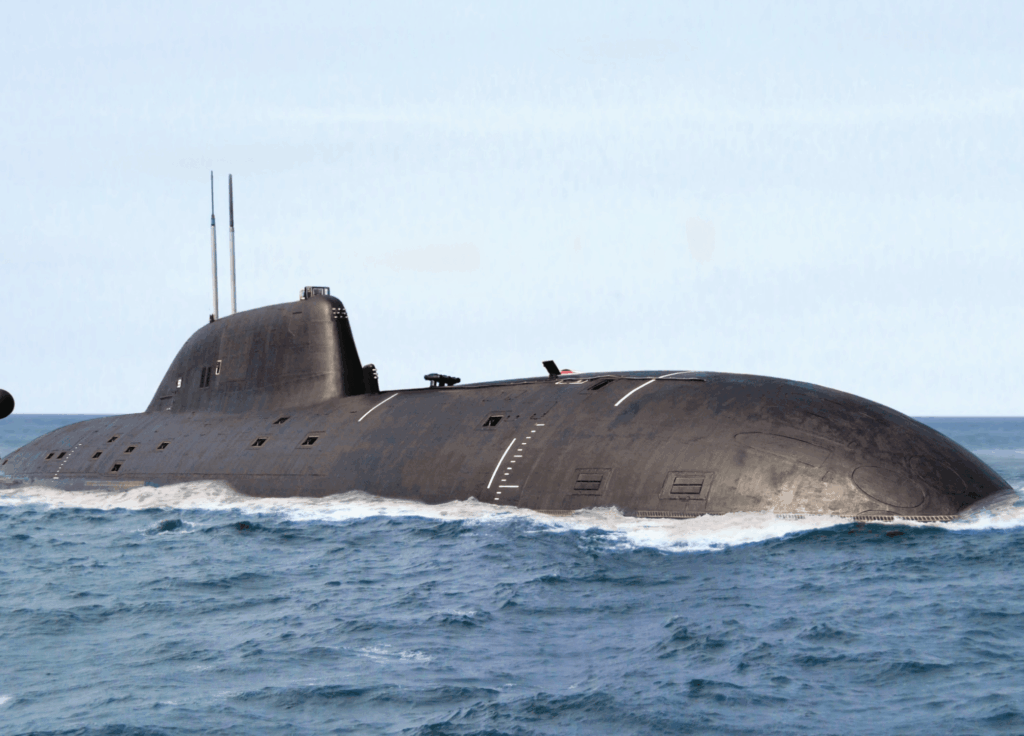 Black naval submarine partially surfaced and underway on open ocean water